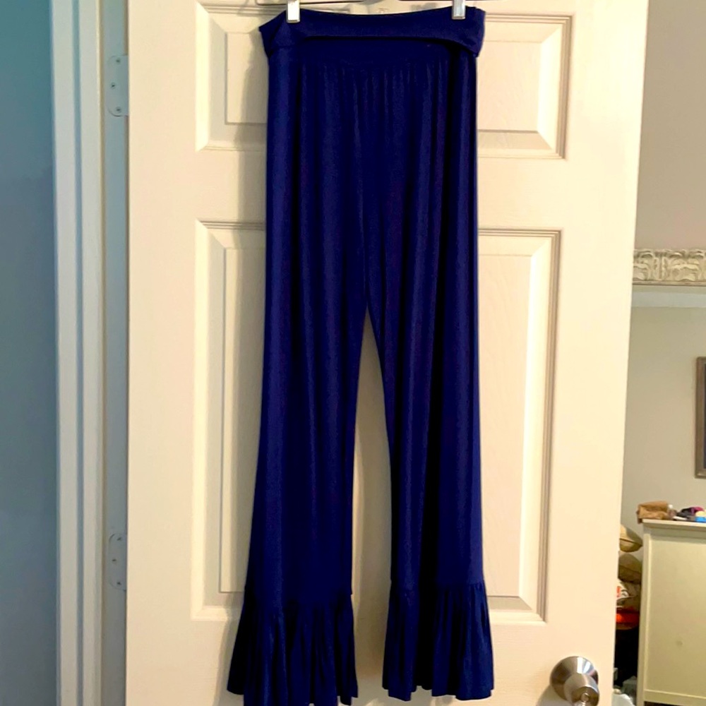 “Adorn” pants with a dressy look and casual feel with ruffled bottom.